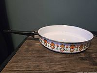 Side view showing floral exterior decoration and handle