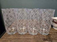 Front view showing all four patterned glasses lined up