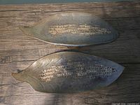 Top view of both leaf-shaped stoneware corn plates