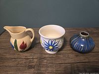 Front view of three ceramic pieces