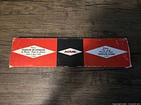 Front of ACME cribbage board box