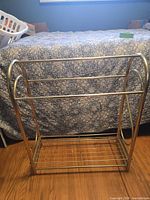 full front view of brass blanket rack
