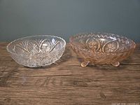 Clear and pink pressed glass bowls side-by-side