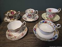 All five Royal Albert teacup and saucer sets displayed on tabletop
