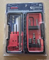 Front view of sealed Bosch TC900 drill bit set showing all included pieces