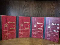Front covers of all four volumes displayed side by side