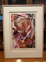 Front view of framed serigraph showing artwork, mat and frame