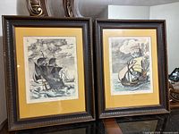 Both framed etchings side by side showing overall condition and matching frames