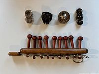 Top view of four Hanayama metal puzzles and Sword Of Nine Seals ring puzzle