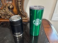 Front view of Yeti Colster and Starbucks tumbler side by side