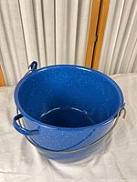Overall view of bucket with bail handle
