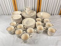 Entire 52-piece Kilkee dinnerware set arranged on table