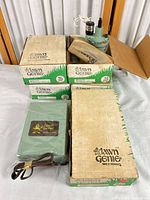 Controller in plastic wrap, four valve boxes, loose valve visible