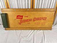 Top view showing branding, padded headrest, wood surface