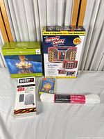 All five boxed/sealed items grouped together