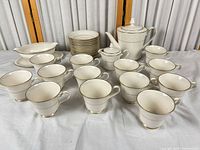 Entire set showing bowls stack, teapot, creamer, gravy boat and 12 cups