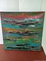 Front view of multicolour abstract painting on canvas