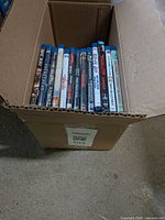 Open box showing 13 Blu-ray cases