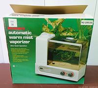 Front of retail box displaying Kenmore automatic warm mist vaporizer