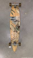 Full view of Sector 9 bamboo longboard showing deck graphic and overall condition