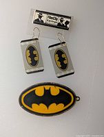 Front view of earrings on card and pendant