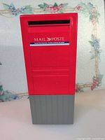 Front view showing coin slot, MAIL / POSTE label and overall condition