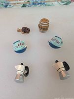 All six coffee-themed resin fridge magnets displayed