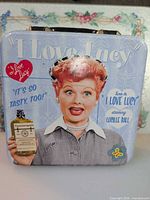 Front view showing Lucille Ball graphic, brand text