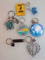 All seven keychains displayed