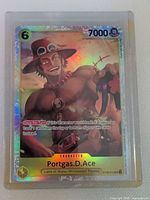 Front of Portgas D. Ace holo foil card showing artwork, stats and foil sheen inside toploader