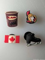 All four shoe charms displayed together