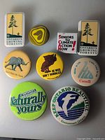 Full set of nine Canadian environmental and political pinback buttons