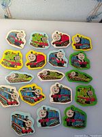 All 18 Thomas & Friends cardboard cutouts laid out showing variety of characters