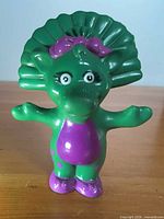 Front view of Baby Bop figurine
