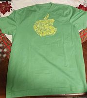 Front view of green Apple graphic T-shirt