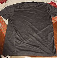 Front view of dark grey athletic shirt