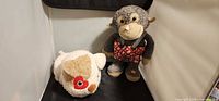 Dog and monkey plush together showing relative size and condition