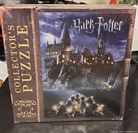 Front of sealed Harry Potter Collector's Puzzle box showing Hogwarts artwork and size icon