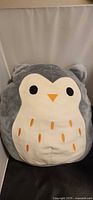 Front view of grey and white owl Squishmallow