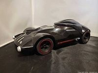 Left front side view of Hot Wheels Darth Vader RC car showing body design and wheels