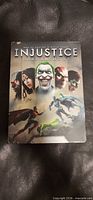Front of Injustice steelbook case with character portraits
