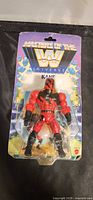 Front view of sealed Kane action figure on card