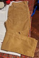 Full view of tan Levi's 511 corduroy pants folded