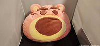 Front view of Lotso face plush pillow