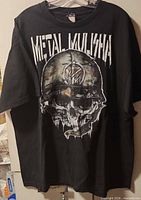 Full view of black Metal Mulisha T-shirt hanging