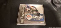 Front view of NASCAR 99 PS1 game in jewel case