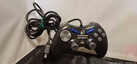 Full view of black Performance Dual Impact 2 wired controller with cable bundled