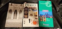 Front covers of the three Prague guidebooks