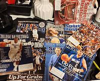 Spread of nine Sports Illustrated magazines showing various basketball-related covers