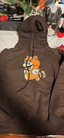Full view of brown hoodie with Super Mario graphic